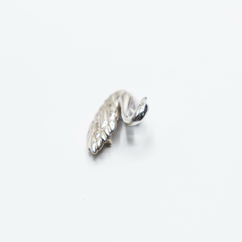 Antique white gold swan pin with diamonds
